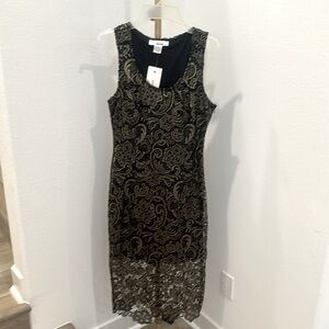 Black Sans Souci dress with gold stitching details